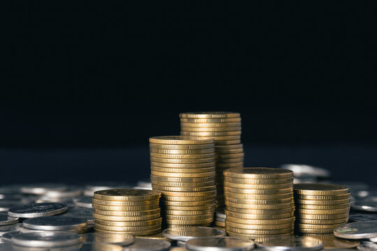 Pile of gold coins on black background - Powered by Adobe