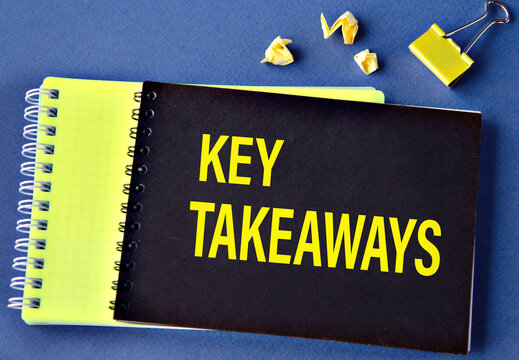 KEY TAKEAWAYS - words on a black notebook on a blue background