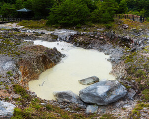 Several views of the Hell of Kumatsu (Komatsujigoku), where a wooden path leads you through a collection of boiling mud pools and steamy fumaroles demonstrating the volcanic activity taking place just