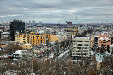 Fototapeta premium Kyiv Podil district winter cityscape with colorful buildings.