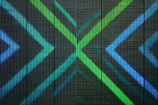 Abstract digital display featuring intersecting diagonal lines in vibrant shades of blue and green