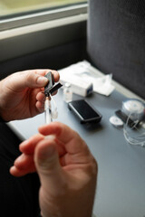 Filling insulin pump cartridge with syringe during pump preparation