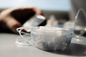 Insulin pump infusion set with introducer needle on table during diabetes care routine