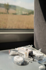Diabetes insulin supplies on train table: vial, syringes and infusion set components