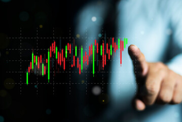 Businessman or investor trader analyze financial data chart trading forex growing virtual hologram...