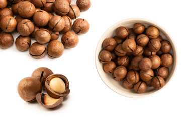 Macadamia nuts in a shell isolated on a white background.