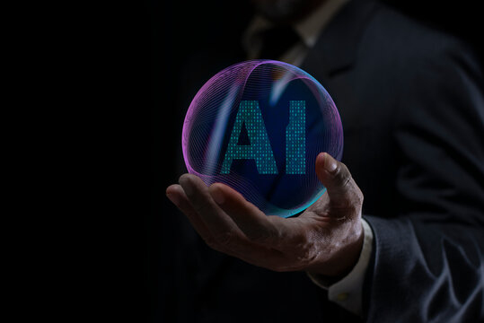 Businessman holding digital AI assistant icon on virtual screen. Tech ai analyzing data. Technology artificial intelligence analysis. Ai analyst machine learning.