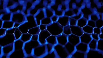 Close-up of an intricate blue hexagonal mesh structure glowing in the dark.
