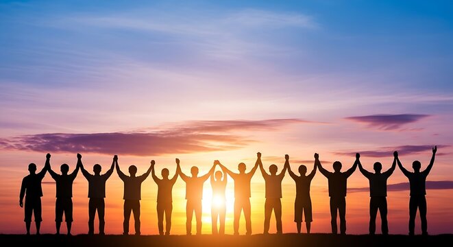 Silhouette of a cheering team holding hands with raised arms against a vibrant sunset sky. (15 words)