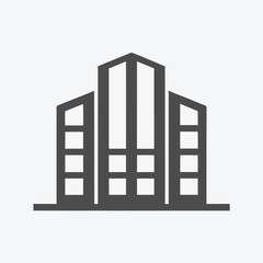 Modern architecture A sleek dark grey building with prominent windows dominates the clean background