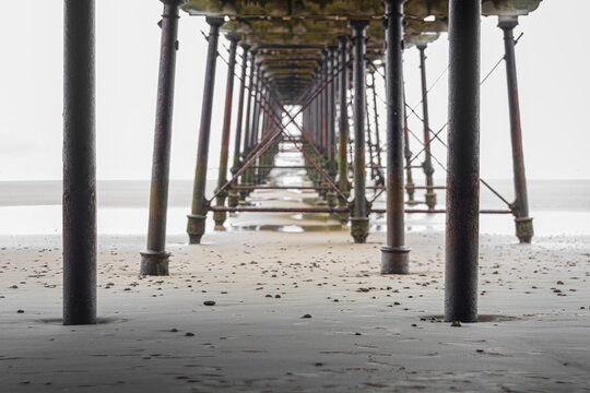 Under Saltburn Pier &mdash; Symmetry, Steel Columns, and Shoreline Perspective in Saltburn-by-the-Sea
