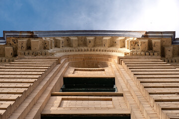 Looking up at dramatic stone window frameS