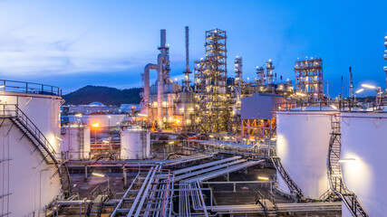 Oil and Gas refinery plant at night, Global business energy logistic transportation, Oil and gas refinery petrochemical industrial, Petrochemical refinery industrial energy supply chain.