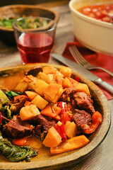 Delicious homemade beef stew with vegetables served in a rustic bowl