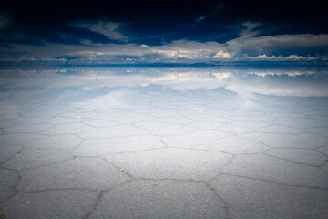 Sky reflection on Uyuni salt flat in Bolivia
