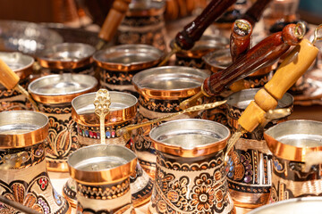 Copper hand-held coffee makers called Turkas at a Turkish bazaar.