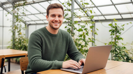 Eco startup founder working on sustainable agriculture solution from greenhouse workspace, ideal for green entrepreneurship stories, climate innovation funding and impact small business growth