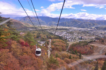 The beautiful view autumn foliage from chairlift at Happo Alpen Line