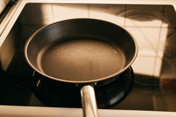 An empty frying pan on the stove