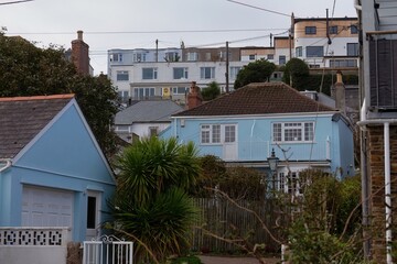 Residential neighborhood with several houses. The houses are of varying sizes and colors, with some having gardens in Perranporth - Cornwall - UK