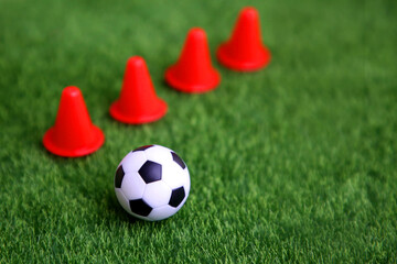 Soccer football training; soccer ball and cones; football coaching academy