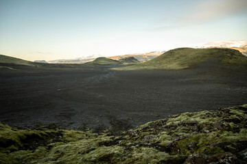 Icelandic landscape with lava fields and fumaroles at sunrise