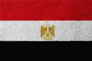 Textured depiction of the Egyptian national flag, showcasing the red, white, and black horizontal...