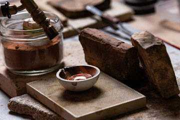 Melting process of a metal with a hand torch for jewelry making