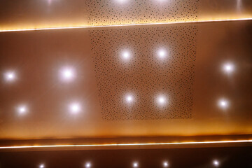 Modern Acoustic Ceiling Design with Bright Spotlights