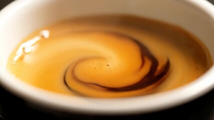Mesmerizing Macro Slow Motion of Fresh Espresso Swirling with Rich Golden Crema in a White Cup - Powered by Adobe