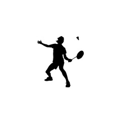 Silhouette of a badminton player in action serving the shuttlecock with a racket