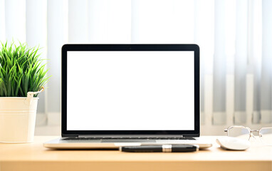 Laptop on Modern Workspace with Blank White Screen &mdash; Mockup for Product Display or Text