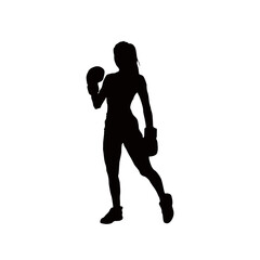 Silhouette of a strong female boxer in fighting stance wearing boxing gloves and athletic wear