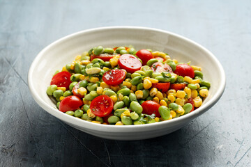 Edamame bean salad with sweet corn, tomato, green onions. Healthy food