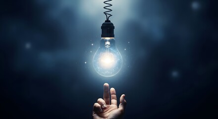 Glowing lightbulb above reaching hand conceptual idea innovation inspiration