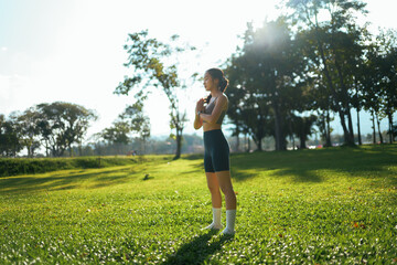 Young woman practicing yoga and mindfulness in park