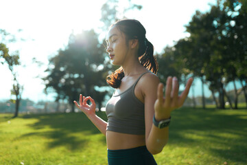 Woman meditating in park for wellness and mindfulness