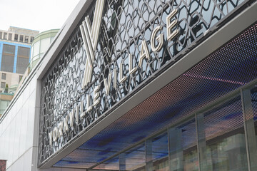 Fototapeta premium exterior building entrance facade and sign of Yorkville Village, a shopping mall, located at 55 Avenue Rd, Toronto