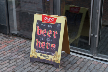 Fototapeta premium Mill St brewery sidewalk sign at The Distillery Historic District, Toronto (21 Tank House Lane)