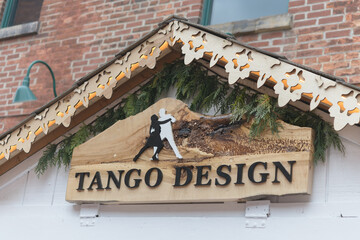 Fototapeta premium cabin with Tango Design sign (handcrafted wooden products) at The Distillery Historic District, Toronto