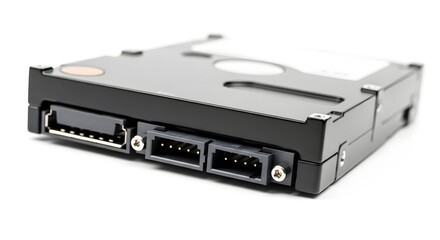A close up of a hard drive with connectors on a white background in a studio environment setting
