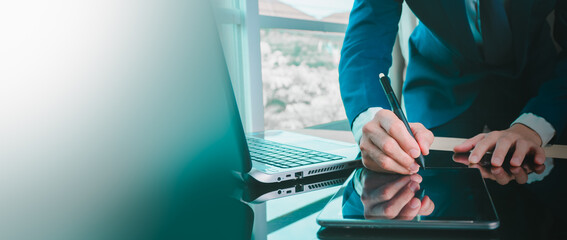 Professional hands signing digital contract on tablet with stylus in modern office, highlighting e-signature technology, secure agreements, corporate efficiency with clean copy space for business use.