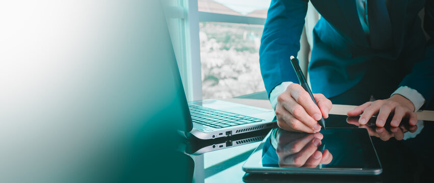 Professional hands signing digital contract on tablet with stylus in modern office, highlighting e-signature technology, secure agreements, corporate efficiency with clean copy space for business use.