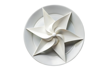 White round plate with decorative paper pinwheel centerpiece arranged in star formation pattern, isolated on a transparent background