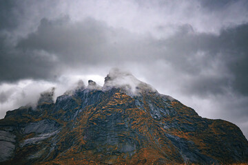 Moody Mountain Peaks Covered in Low Hanging Clouds
