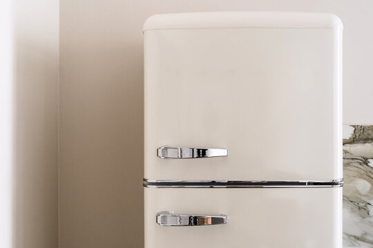 Classic retro fridge design in a cozy kitchen space with modern touches