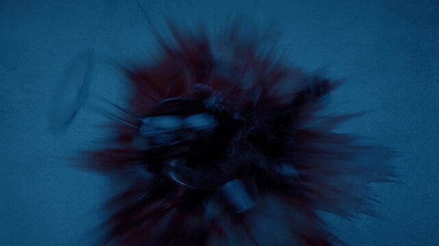 Wine Glass Smashes On Floor In Dark Room

