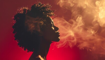 Golden Sparks and Dramatic Lighting on an Afro Silhouette. Celebrating Natural Hair and Beauty on Black Awareness Day.
