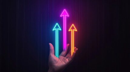A vibrant hand holds colorful, glowing arrows pointing upward, symbolizing growth, progress, and positivity against a dark background.