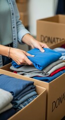 Clothing donation concept with people sorting and organizing garments